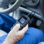 Technician using scan tool